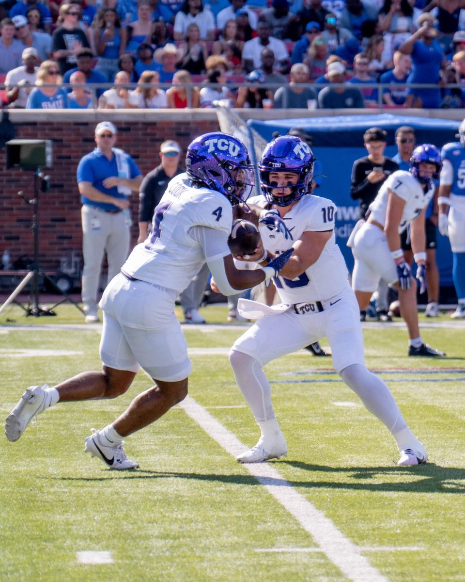 Josh Hoover hands off the ball to Cam Cook at Gerald J. Ford Stadium, Sept. 21, 2024. The TCU Horned Frogs were defeated by the SMU Mustangs 44-66. (TCU 360 Photo by Shane Manson)