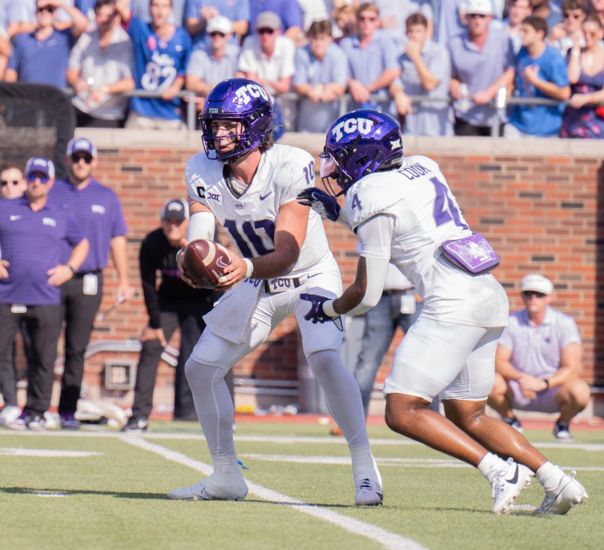 Josh Hoover hands off the ball to Cam Cook at Gerald J. Ford Stadium, Sept. 21, 2024. The TCU Horned Frogs were defeated by the SMU Mustangs 44-66. (TCU 360 Photo by Shane Manson)