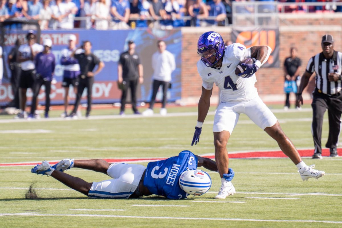 Cam Cook attempts to break a tackle at Gerald J. Ford Stadium, Sept. 21, 2024. The TCU Horned Frogs were defeated by the SMU Mustangs 44-66. (TCU 360 Photo by Shane Manson)