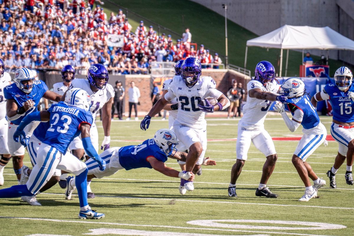 Running back Dominique Johnson advances the ball at Gerald J. Ford Stadium, Sept. 21, 2024. The TCU Horned Frogs were defeated by the SMU Mustangs 44-66. (TCU 360 Photo by Shane Manson)