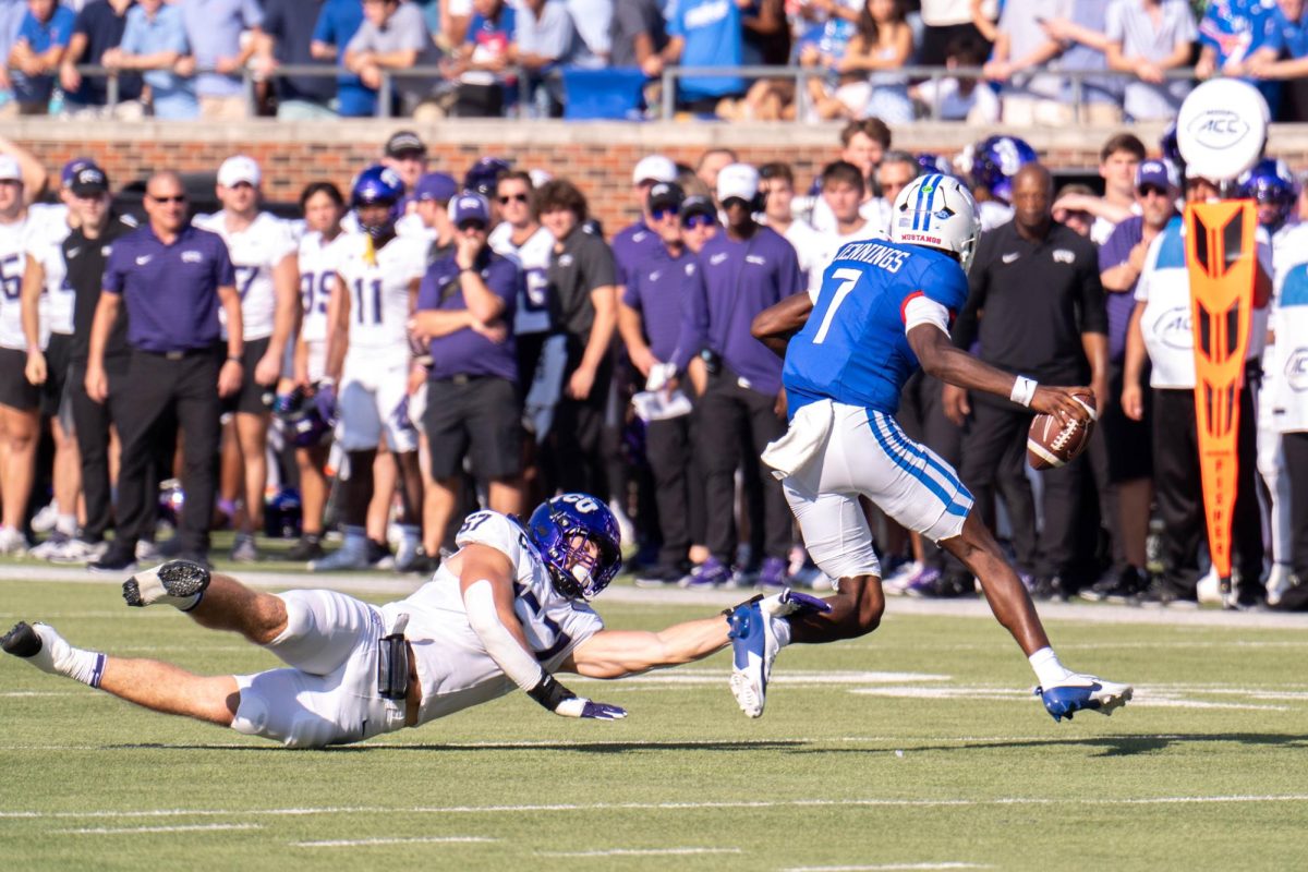 Linebacker Johnny Hodges attempts to tackle QB Kevin Jennings at Gerald J. Ford Stadium, Sept. 21, 2024. The TCU Horned Frogs were defeated by the SMU Mustangs 44-66. (TCU 360 Photo by Shane Manson)