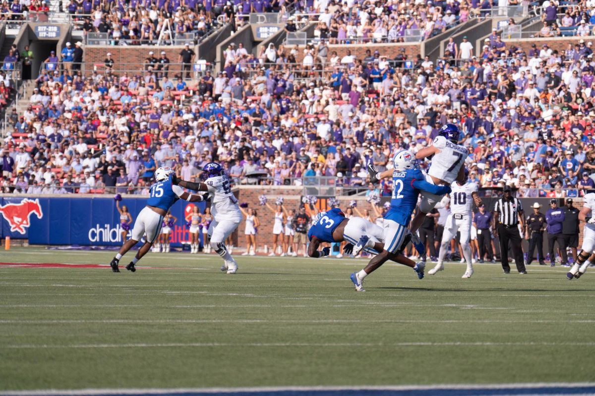 Wide receiver JP Richardson is tackled after a reception at Gerald J. Ford Stadium, Sept. 21, 2024. The TCU Horned Frogs were defeated by the SMU Mustangs 44-66. (TCU 360 Photo by Shane Manson)