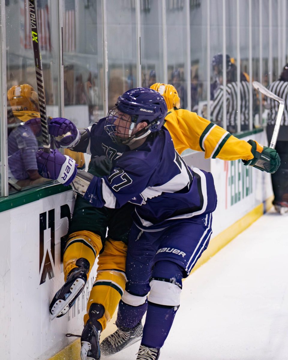 Ethan Schier checks a Baylor player into the boards, Sept. 13, 2024, at the StarCenter in Mansfield, Texas. The TCU Horned Frogs beat the Baylor Bears 12-5. (TCU 360 Photo by Shane Manson)