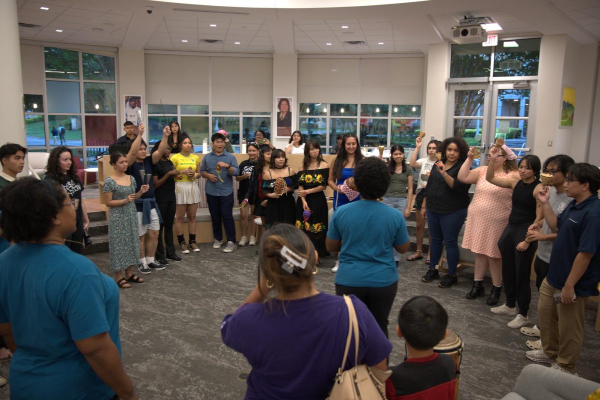 Students and faculty learn how to play traditional Brazilian instruments with Ondas Community. 