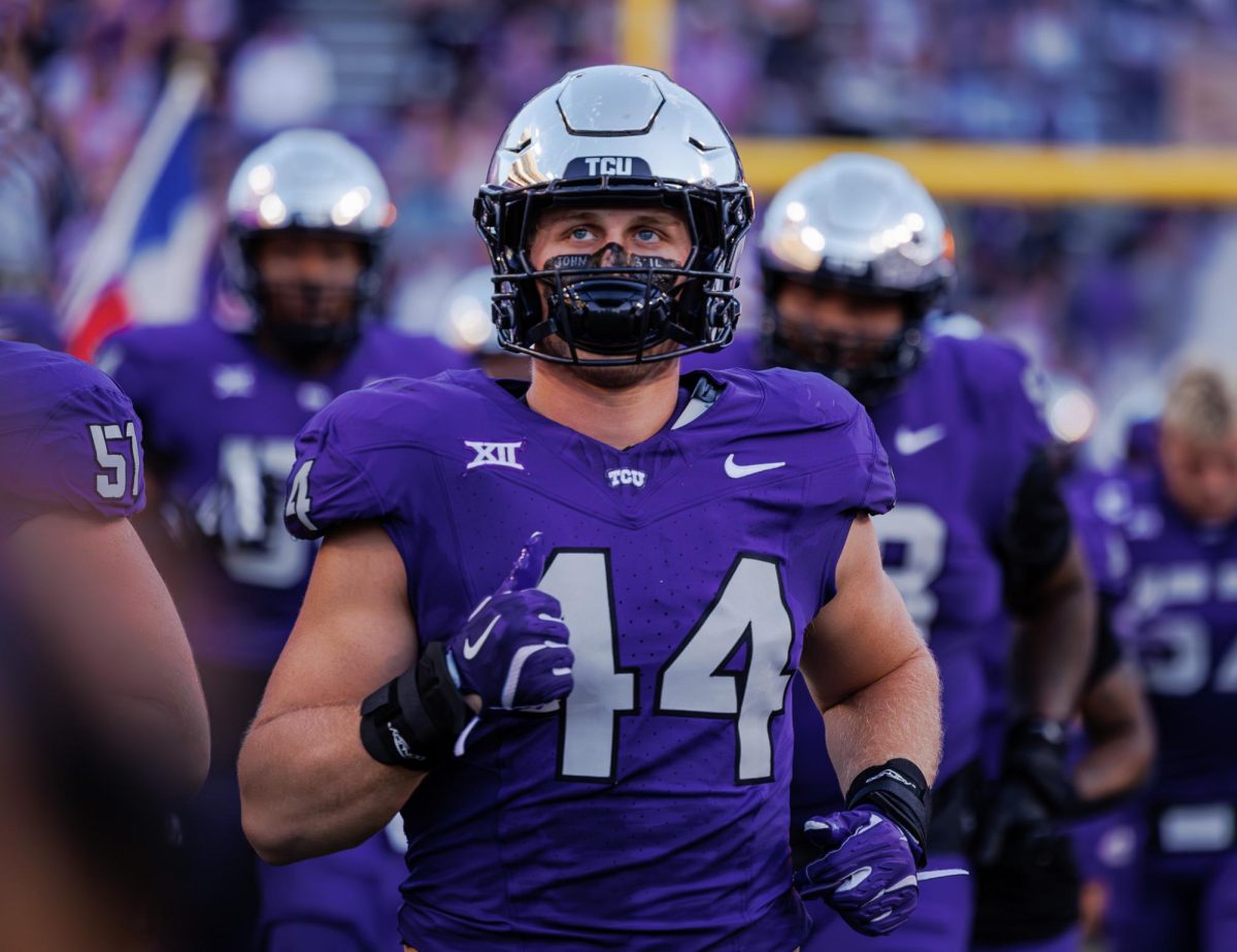 TCU linebacker Cooper McDonald runs out of the tunnel with the team at Amon G. Carter Stadium in Fort Worth, Texas on October 4th, 2024. The TCU Horned Frogs fell to the Houston Cougars 19-31 (TCU360/Tyler Chan)