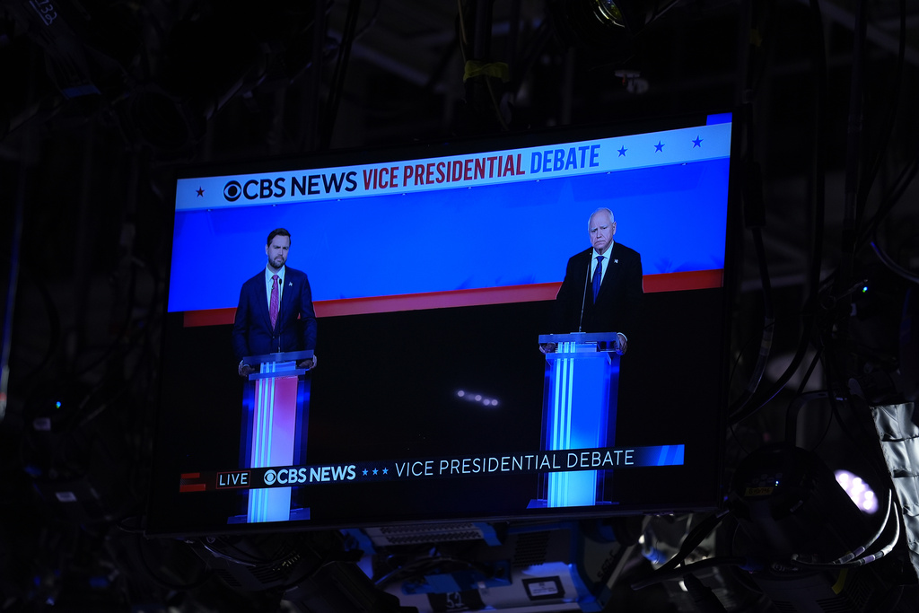 Republican vice presidential nominee Sen. JD Vance, R-Ohio, and Democratic vice presidential nominee Minnesota Gov. Tim Walz, participate during a CBS News vice presidential debate in New York, Tuesday, Oct. 1, 2024. (AP Photo/Matt Rourke)