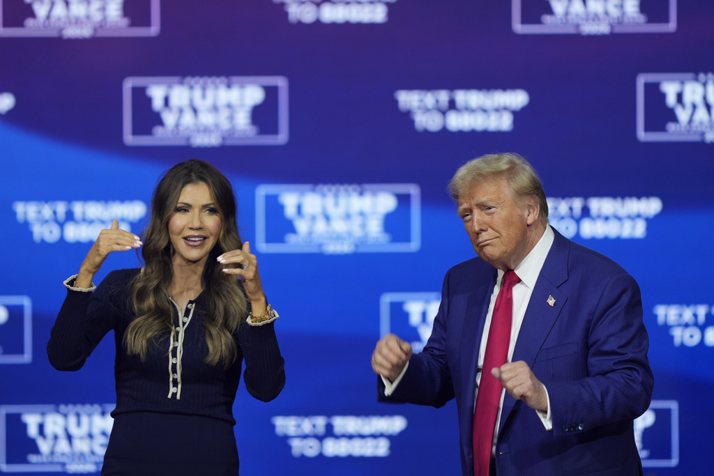 Republican presidential nominee former President Donald Trump and South Dakota Gov. Kristi Noem dance to the song "Y.M.C.A." at a campaign town hall at the Greater Philadelphia Expo Center &amp; Fairgrounds, Monday, Oct. 14, 2024, in Oaks, Pa. (AP Photo/Matt Rourke)