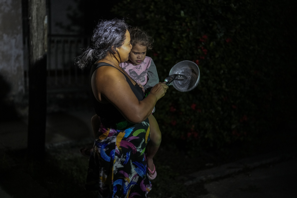 Residents protest by banging pots and pans in Havana, Cuba, Sunday, Oct. 20, 2024. (AP Photo/Ramon Espinosa)