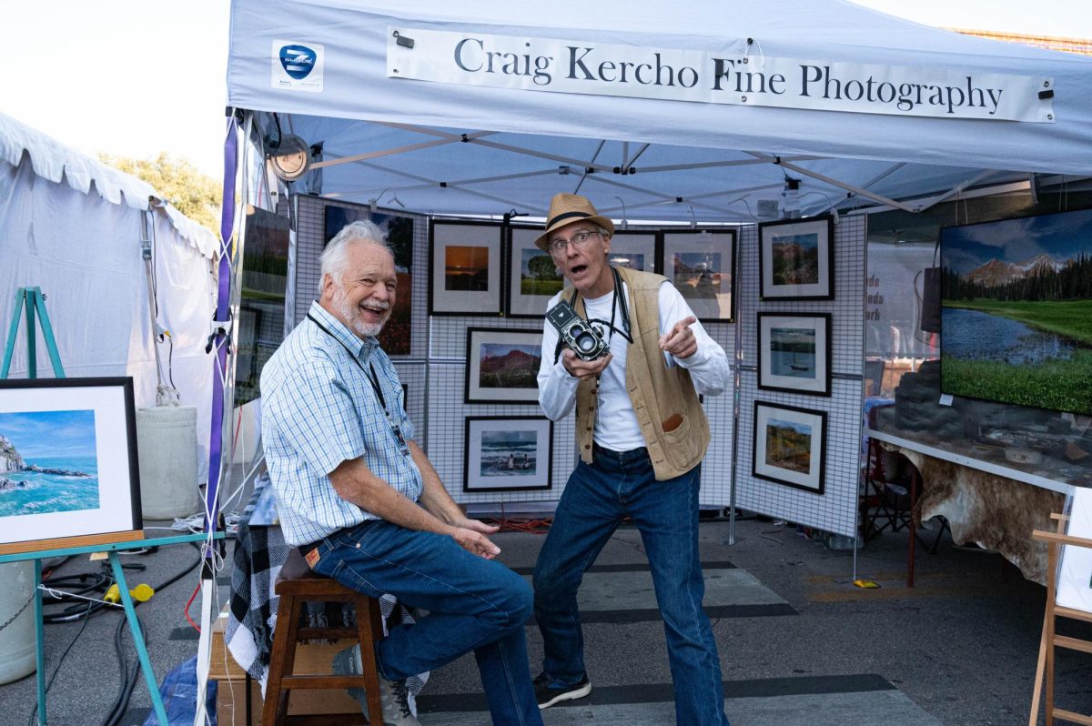 Craig Kercho and his friend from Fine Photography, pose for their own photograph at ArtsGoggle. (Grace Lewis/ Staff Writer)