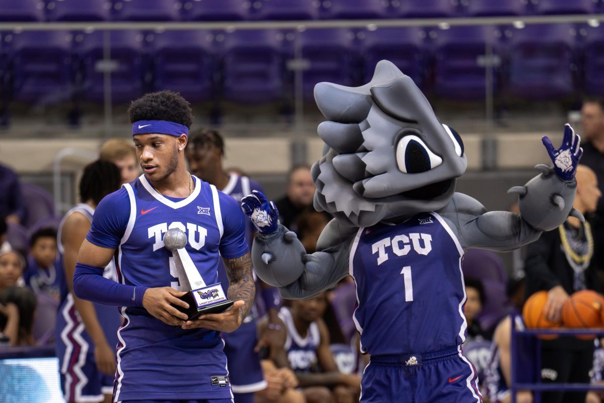 Micah Robinson is presented a trophy by Superfrog at Schollmaier Live, Oct. 25, 2024.