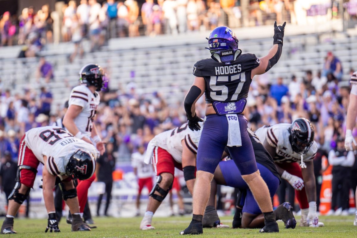 Johnny Hodges communicates with the defense prior to the snap at Amon G. Carter Stadium, Oct. 26, 2024. TCU overcame a 17-point deficit to defeat Texas Tech 35-34. (TCU 360 Photo by Shane Manson)