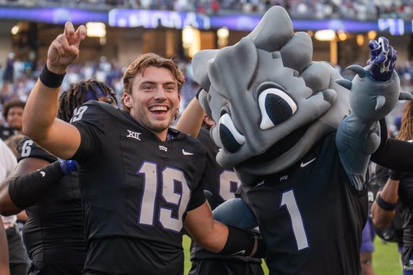 Backup quarterback Ken Seals and Superfrog celebrate after defeating Texas Tech. (TCU 360 Photo by Shane Manson)