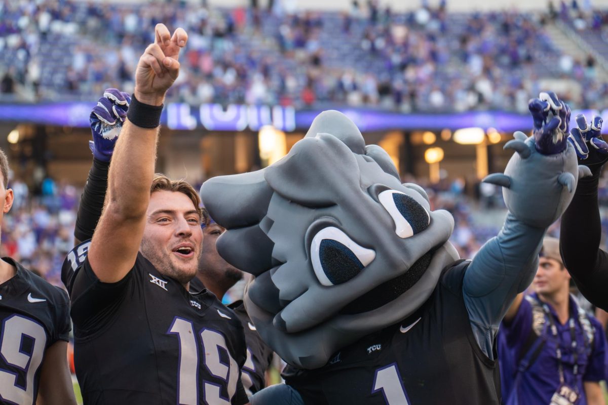 Backup QB Ken Seals and Superfrog celebrate a win at Amon G. Carter Stadium, Oct. 26, 2024. TCU overcame a 17-point deficit to defeat Texas Tech 35-34.