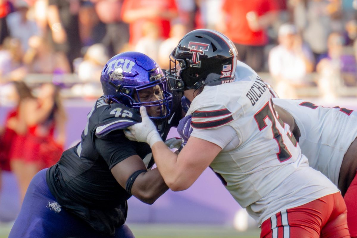 Zachary Chapman attempts to shed a block at Amon G. Carter Stadium, Oct. 26, 2024. TCU overcame a 17-point deficit to defeat Texas Tech 35-34. (TCU 360 Photo by Shane Manson)