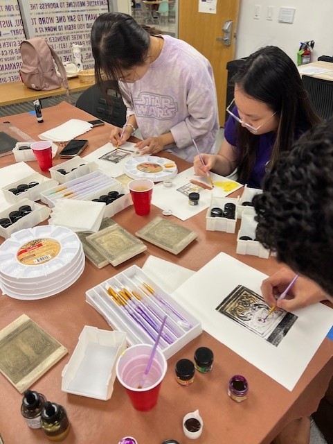 Students paint their personal prints in the library Fab Lab, Oct. 24, 2024. (Credit: Christine Drake-Thomas)