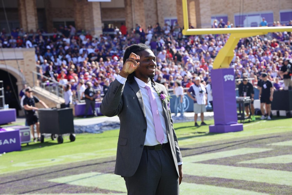 Adebanjo posing on the field during the recognition of the Outstanding Senior finalists. (Photo courtesy of Oreo Adebanjo)