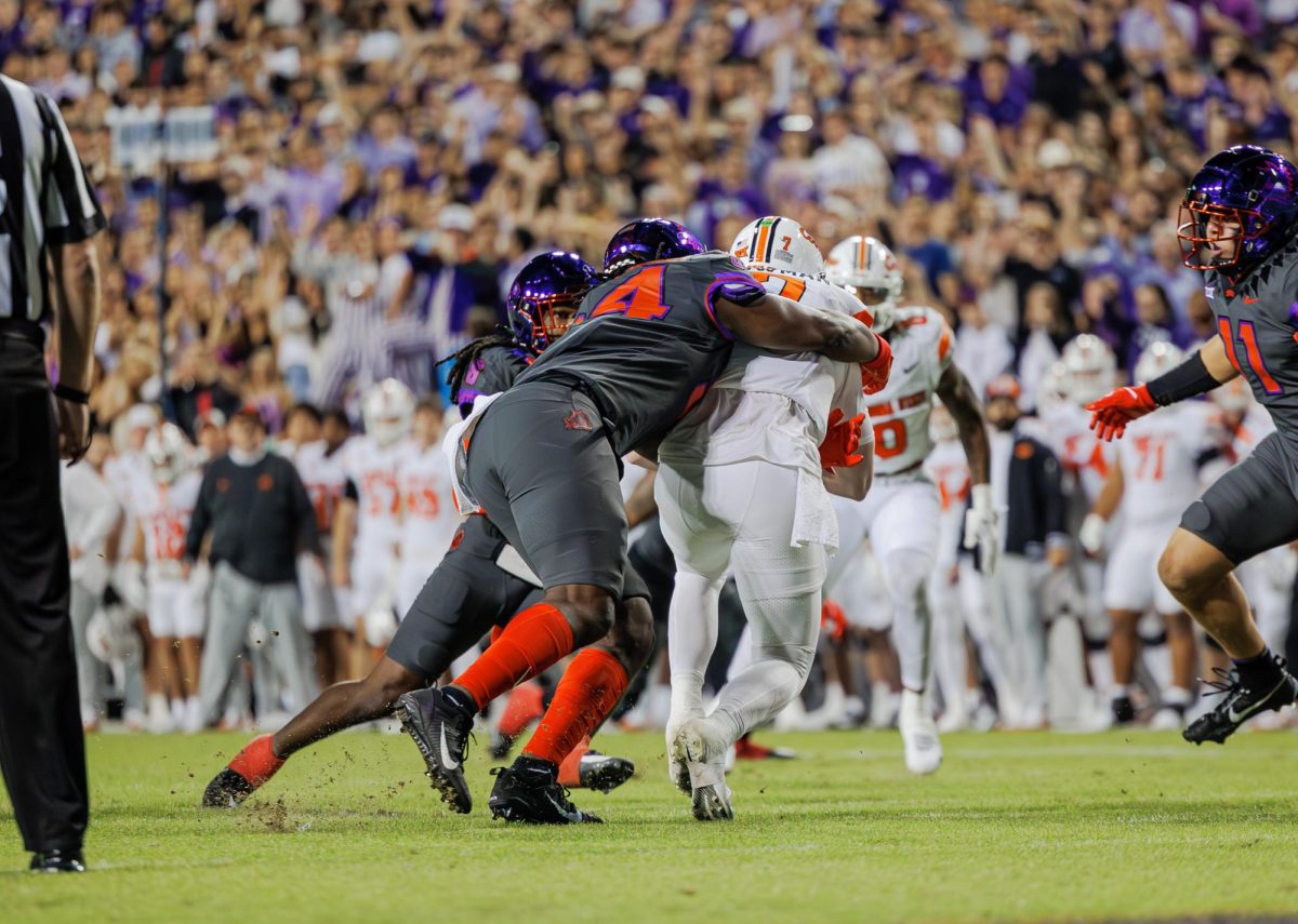 TCU defensive linemen NaNa Osafo-Mensah sacks the quarterback at Amon G. Carter Stadium in Fort Worth, Texas on November 9th, 2024. The TCU Horned Frogs beat the Oklahoma State Cowboys 38-13. (TCU360/ Tyler Chan)