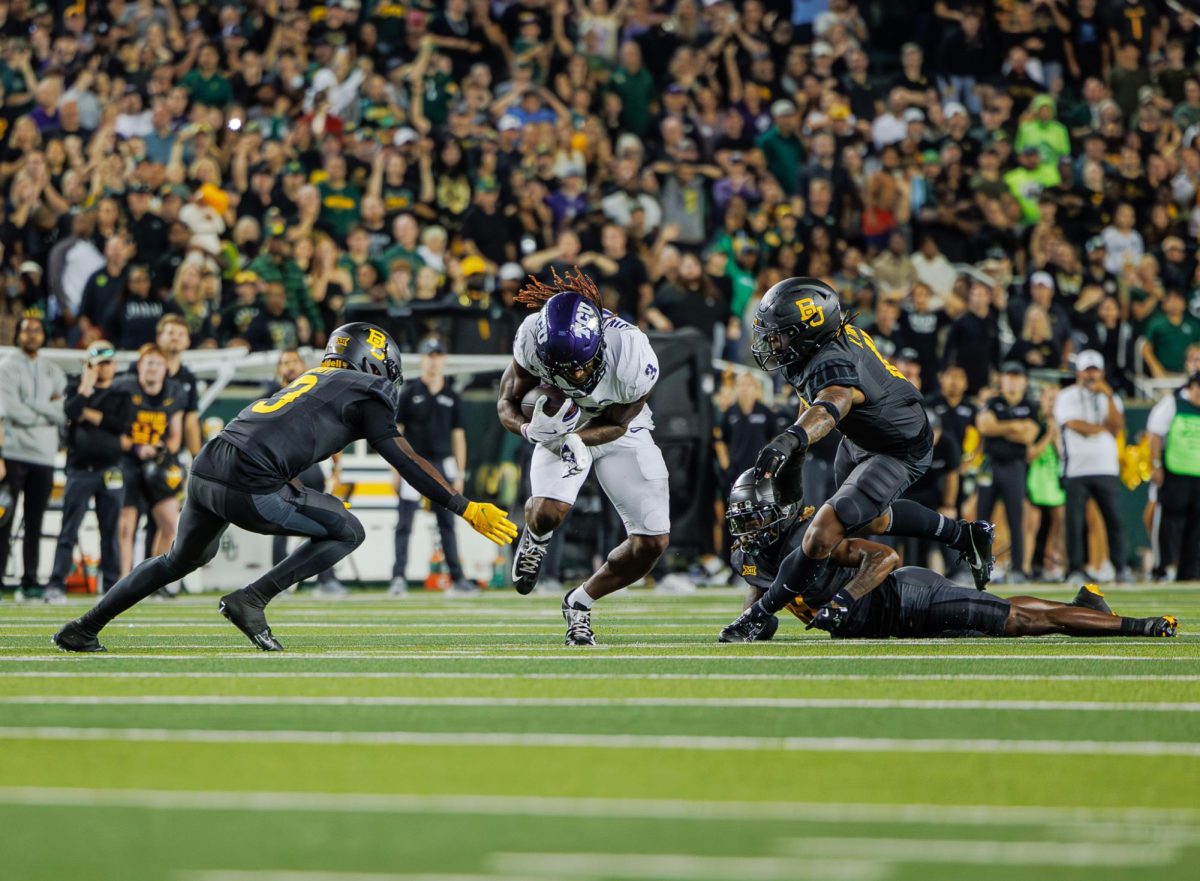 TCU wide receiver Savion Williams runs through the defense at McLane Stadium in Waco, Texas on November 2nd, 2024. The TCU Horned Frogs fell to the Baylor Bears 34-37.(TCU360/ Tyler Chan)