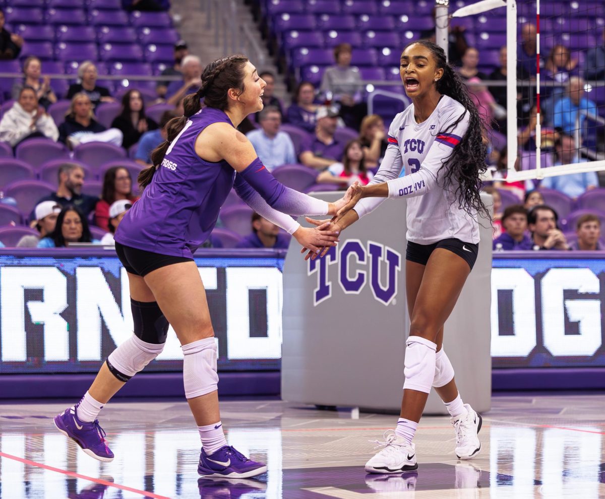 TCU players Alice Volpe and Evan Hendrix celebrate after the play at Schollmaier Arena in Fort Worth, Texas on November 7th, 2024. The TCU Horned Frogs swept the UCF Knights 3-0. (TCU360/ Tyler Chan)