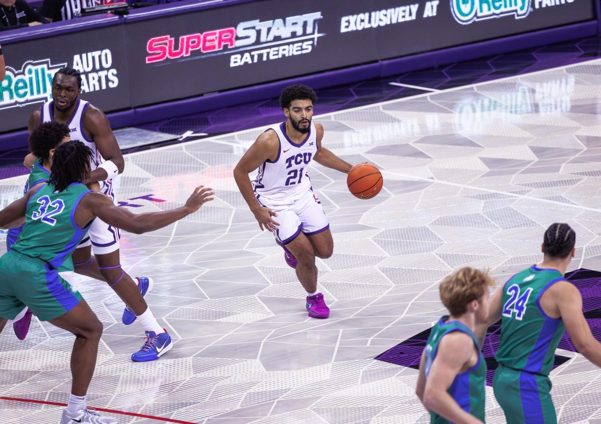 TCU guard Noah Reynolds dribbles the ball at Schollmaier Arena in Fort Worth, Texas on November 8th, 2024 (TCU360/ Tyler Chan)