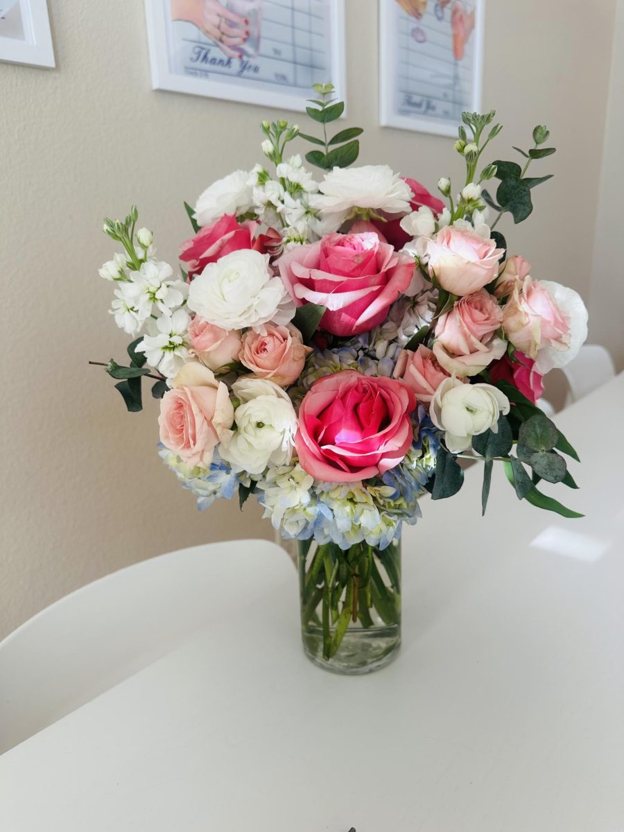 Floral arrangement by The A's Bouquets.