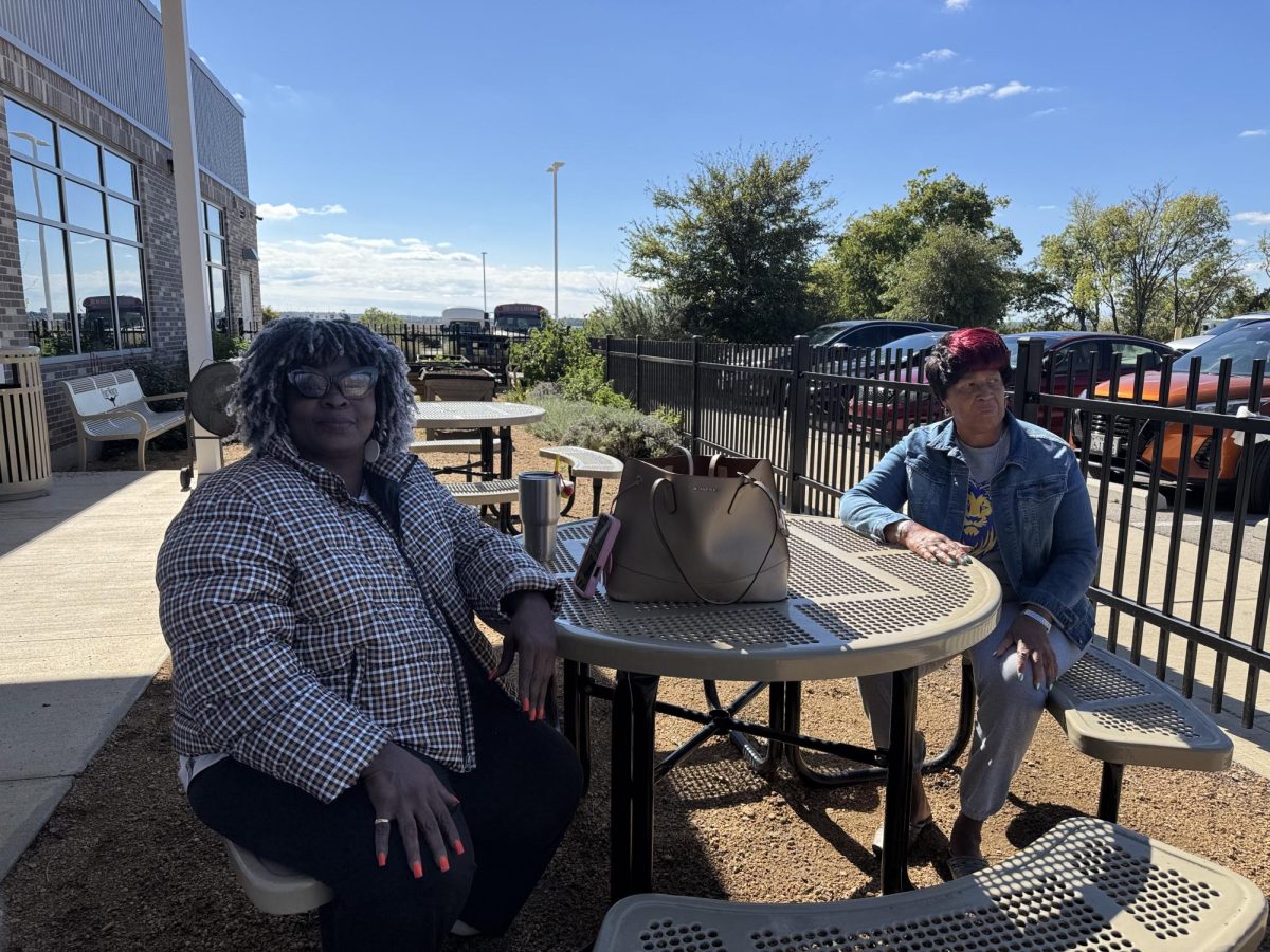 Two women discussing the election after voting at the Como Community Center.