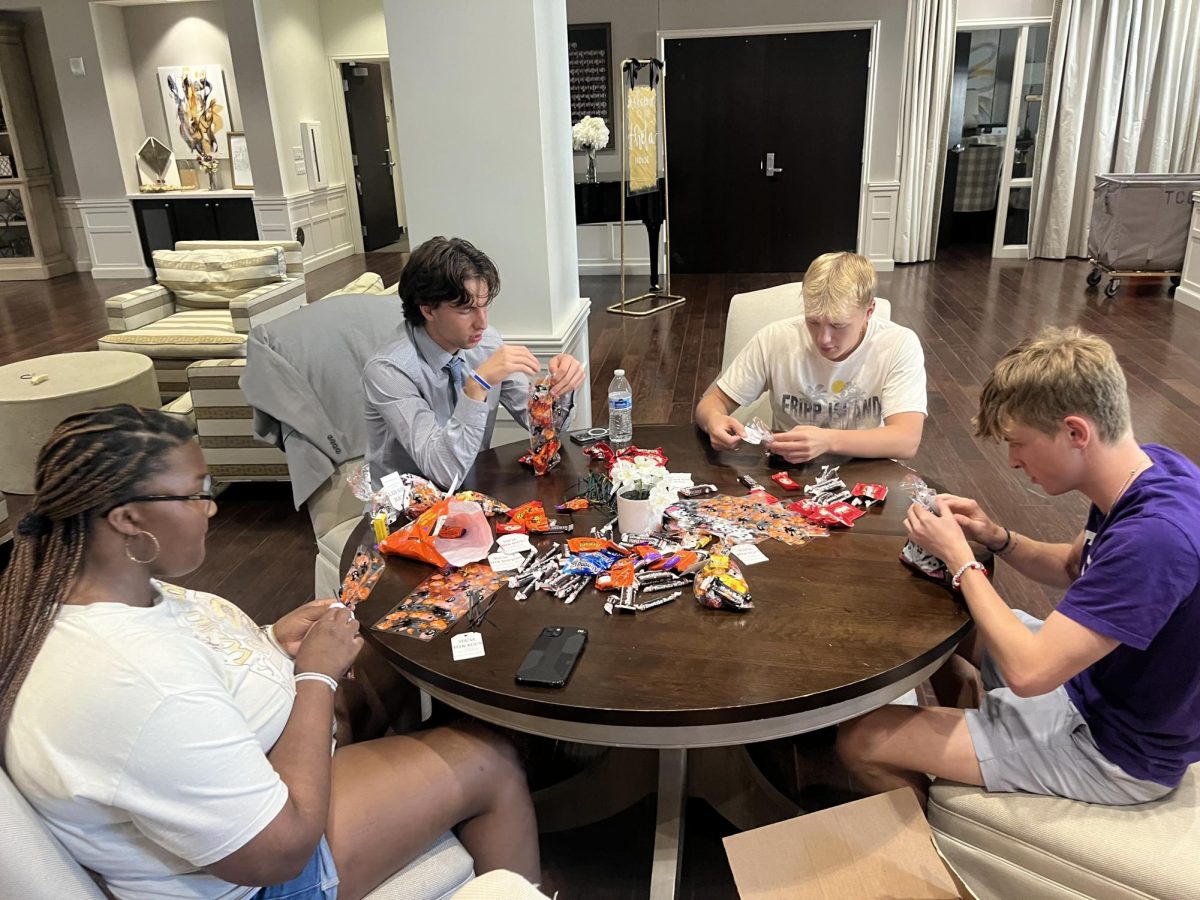 TCU students filling goodie bags for Bags of Joy.