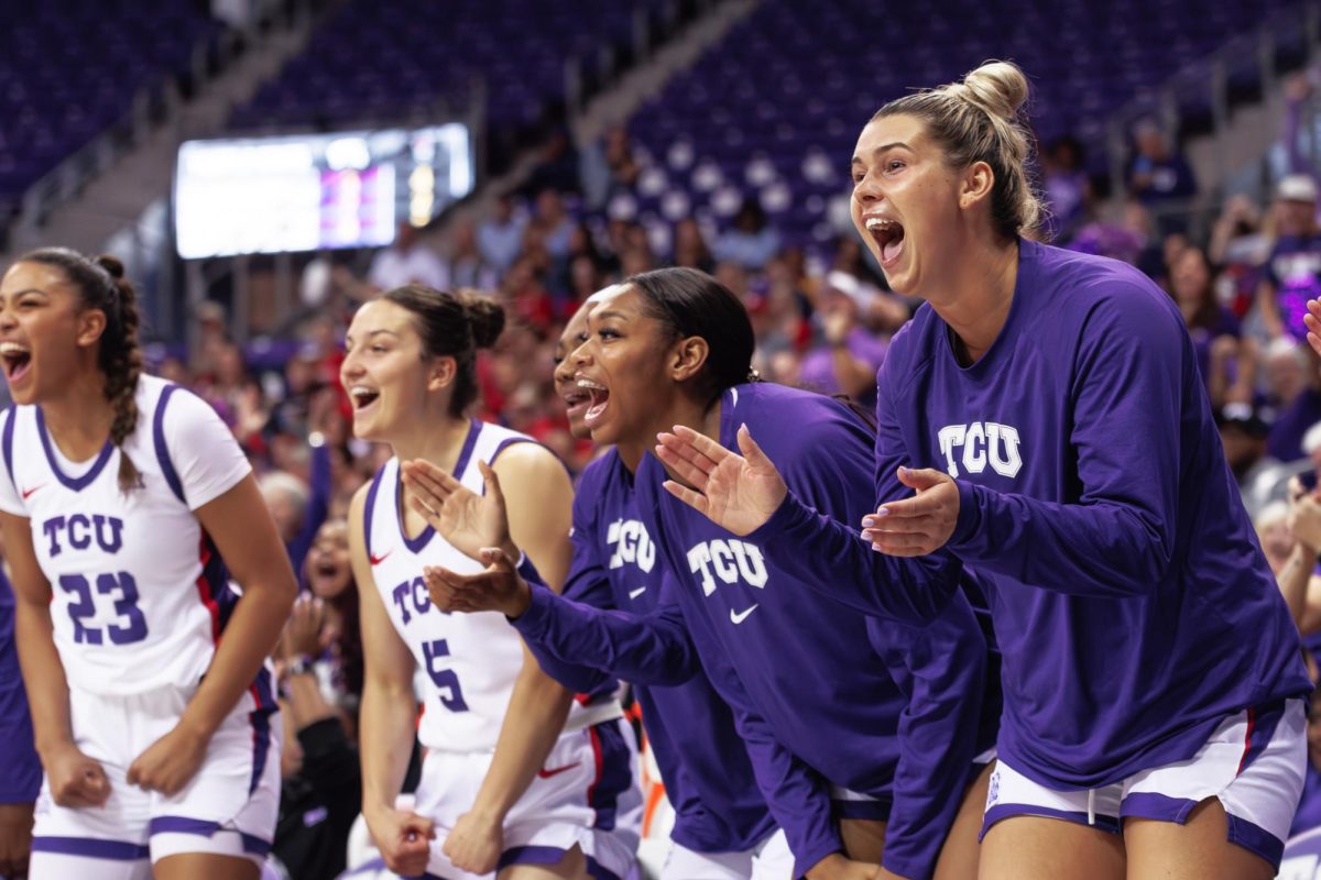 TCU bench celebrates after the play at Schollmaier Arena in Fort Worth, Texas on November 17th, 2024. The TCU Horned Frogs beat the NC State Wolfpack 76-73. (TCU360/Tyler Chan)