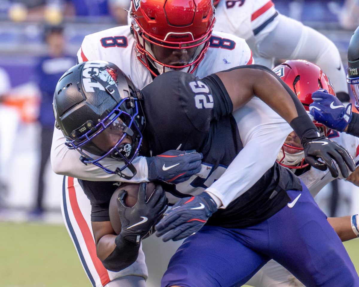 Jeremy Payne is tackled at Amon G. Carter Stadium, Nov. 23, 2024. The TCU Horned Frogs beat the Arizona Wildcats 49-28. (TCU 360 Photo by Shane Manson)