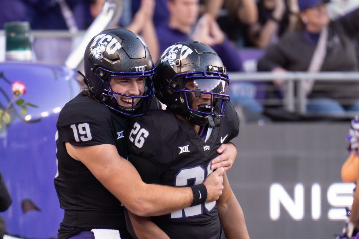 Ken Seals and Jeremy Payne celebrate a touchdown at Amon G. Carter Stadium, Nov. 23, 2024. The TCU Horned Frogs beat the Arizona Wildcats 49-28. (TCU 360 Photo by Shane Manson)