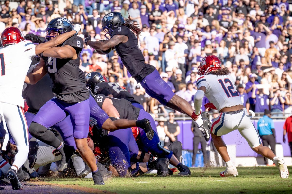 Wide receiver Savion Williams hurdles into the end zone at Amon G. Carter Stadium, Nov. 23, 2024. The TCU Horned Frogs beat the Arizona Wildcats 49-28. (TCU 360 Photo by Shane Manson)