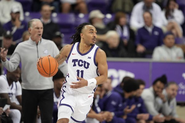 TCU guard Frankie Collins advances the ball upcourt against Xavier during an NCAA college basketball game in Fort Worth, Texas, Thursday, Dec. 5, 2024. (AP Photo/Tony Gutierrez)