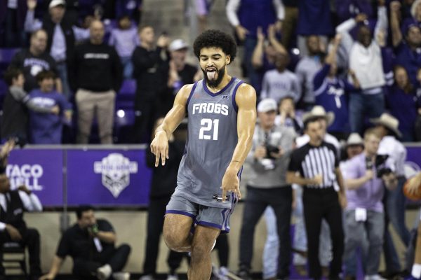 TCU guard Noah Reynolds (21) celebrates after making the game-winning shot late in the second half of an NCAA college basketball game against Kansas State, Saturday, Jan. 4, 2025, at Schollmaier Arena in Fort Worth, Texas. (Chris Torres/Star-Telegram via AP)