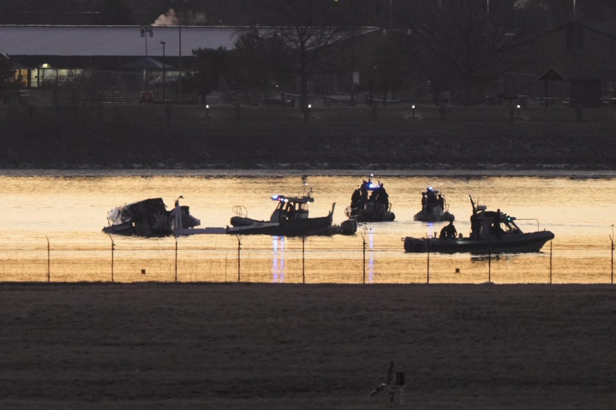 Search and rescue efforts are seen around a wreckage site in the Potomac River from Ronald Reagan Washington National Airport, early Thursday morning, Jan. 30, 2025, in Arlington, Va. 