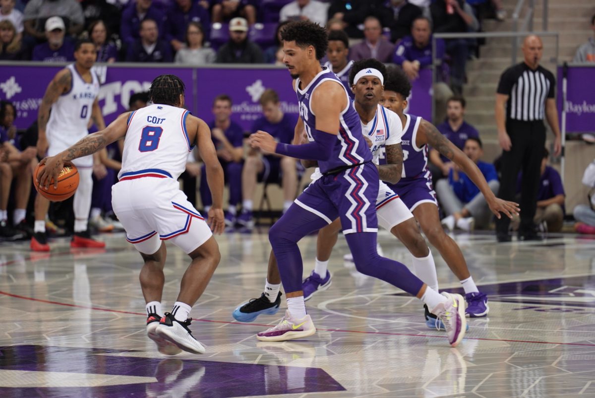 TCU guard Brendan Wenzel guarding Kansas' David Coit on Wednesday, Jan. 22 at Ed and Rae Schollmaier Arena. 