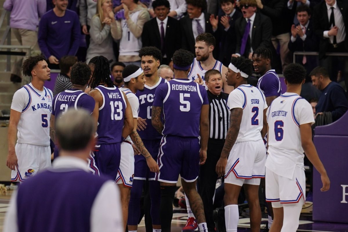 The TCU men's basketball team in a timeout huddle against No. 9 Kansas on Wednesday, Jan. 22 at Ed and Rae Schollmaier Arena.