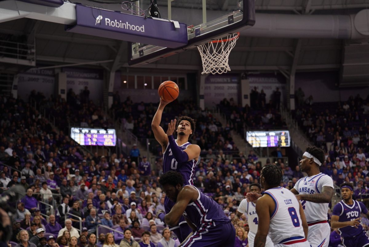 Brendan Wenzel going up for a layup against No. 9 Kansas on Wednesday, Jan. 22 at Ed and Rae Schollmaier Arena.