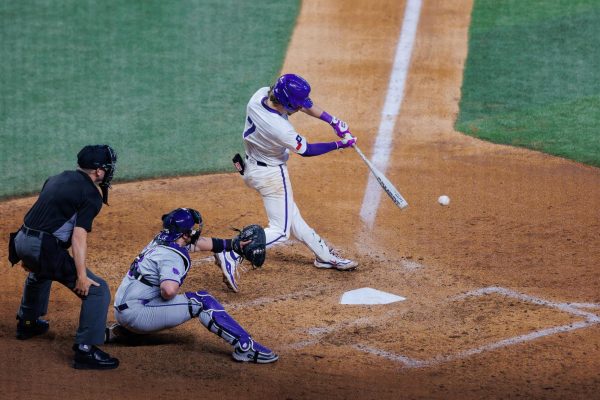 TCU second basemen Cole Cramer hits the ball at Globe Life Field in Arlington, Texas Feb. 23, 2025. The TCU Horned Frogs fell to the Kansas State Wildcats 10-2. (TCU360/ Tyler Chan)