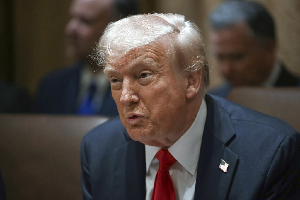 President Donald Trump holds his first Cabinet meeting at the White House in Washington, Wednesday, Feb. 26, 2025. (Pool via AP)