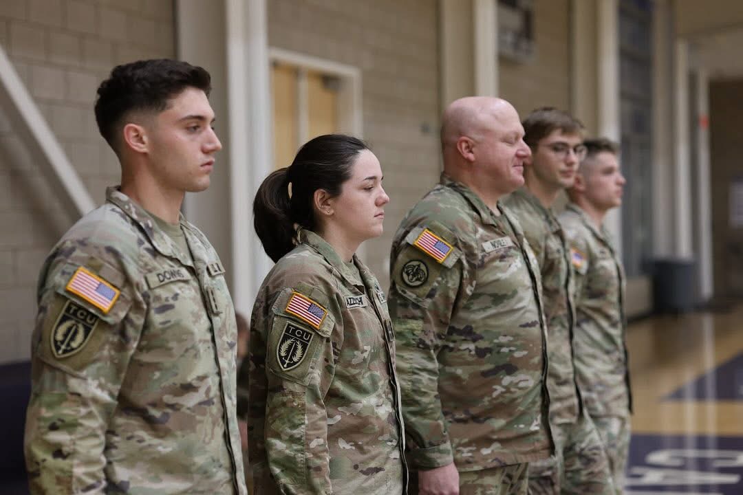 ROTC cadets dressed in uniform in the Recreational Gym. Courtesy of the TCU Army ROTC.