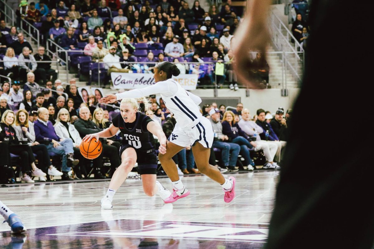 Hailey Van Lith attempting a lay-up by herself.