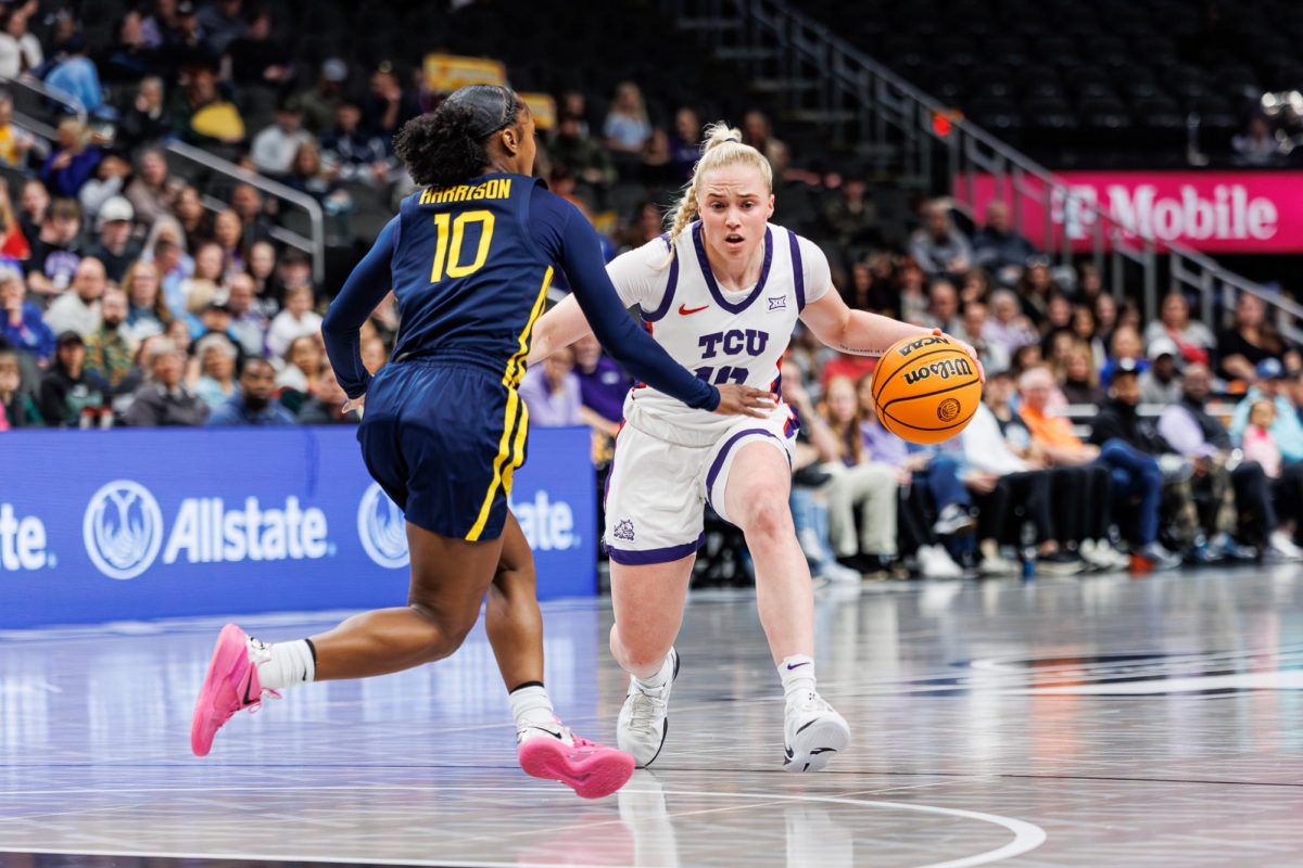 TCU guard Hailey Van Lith dribbles the ball towards the basket at T-Mobile Arena in Kansas City, Missouri Mar. 8, 2025. The TCU Horned Frogs beat the West Virginia Mountaineers 71-65. (TCU360/Tyler Chan)