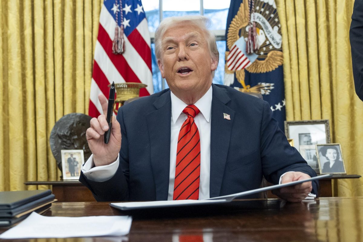 President Donald Trump speaks with reporters as he signs executive orders in the Oval Office at the White House, Monday, Feb. 10, 2025, in Washington. 