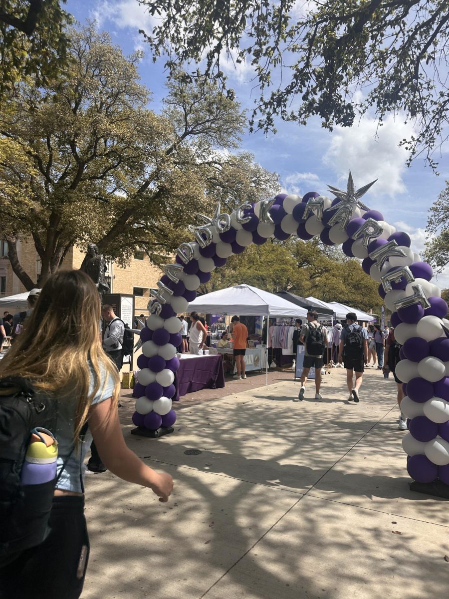 TCU students pass Shaddock Marketplace on their way to class on Thursday, March 27.
