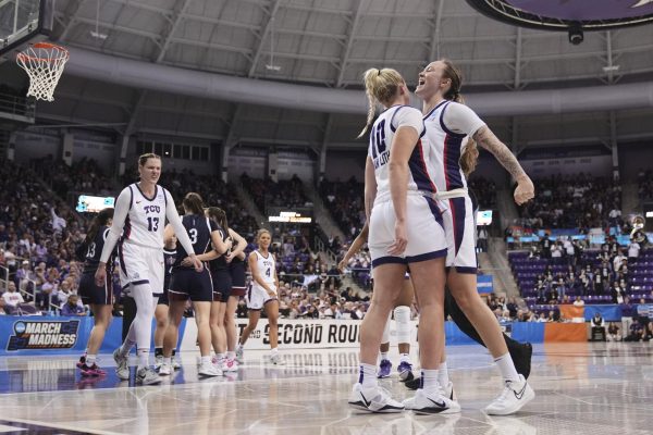 TCU guard Hailey Van Lith (10), Madison Conner, right, and Sedona Prince (13) celebrate a basket by Van Lith against Fairleigh Dickinson on March 21, 2025. (AP Photo/Tony Gutierrez)