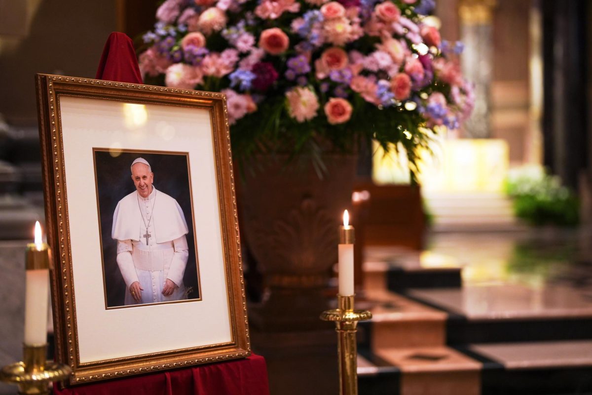 A picture of Pope Francis is displayed inside the Cathedral Basilica of Saints Peter and Paul, Monday, April 21, 2025, in Philadelphia. (AP Photo/Matt Slocum)