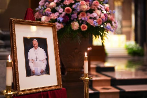 A picture of Pope Francis is displayed inside the Cathedral Basilica of Saints Peter and Paul, Monday, April 21, 2025, in Philadelphia. (AP Photo/Matt Slocum)