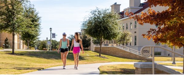 Two women walking in Greek Village in Worth Hills on TCU’s Campus. (admissions.tcu.edu)