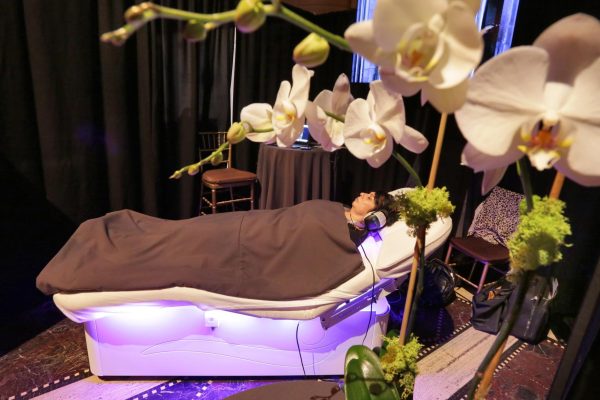 A customer enjoys herself in the Spa Wave bed from the Âme Spa & Wellness Collective, Aug. 8, 2017. (AP Photo/Richard Drew)