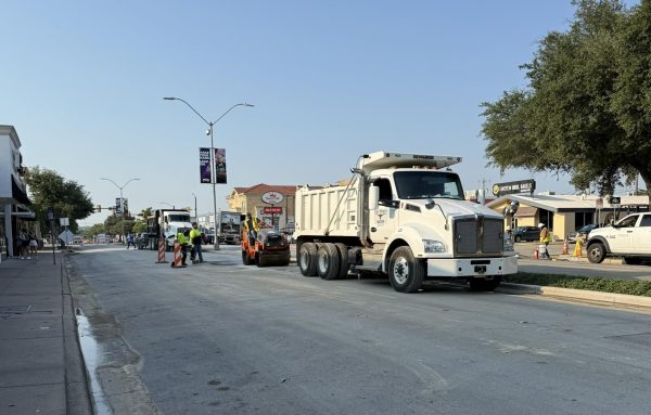 Crews work to repair the water main break on University Drive. (Perrin Gilman)